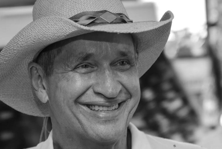 Portrait of Francisco José Wadskier Bocaranda smiling, wearing a hat